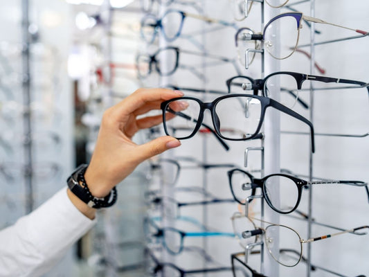 Patient choosing glasses with an NHS optical voucher at Direct Vision Opticians Birmingham